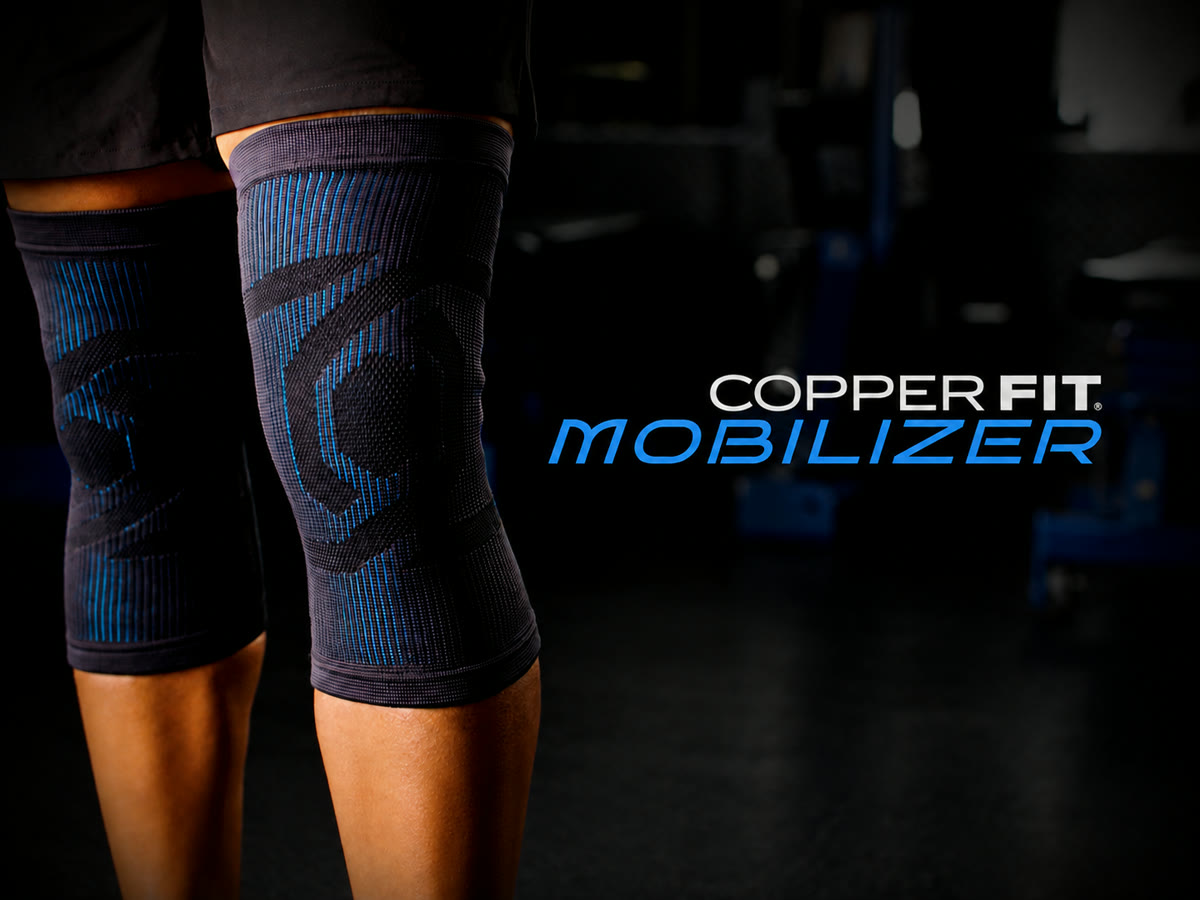 Copper Fit Mobilizer compression knee sleeve worn in a gym